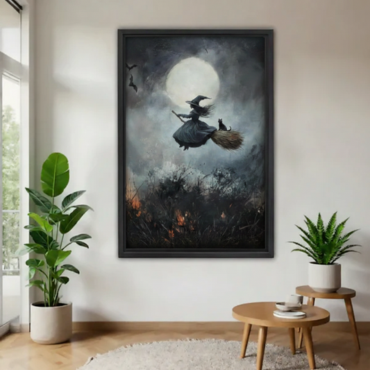 Framed witch and black cat broomstick full moon wall art in black floater frame on white wall