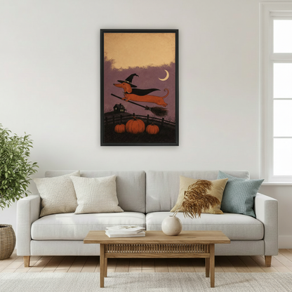 Folk art dachshund in black witch hat flying on broomstick over orange pumpkins and haunted house under crescent moon framed canvas above grey sofa