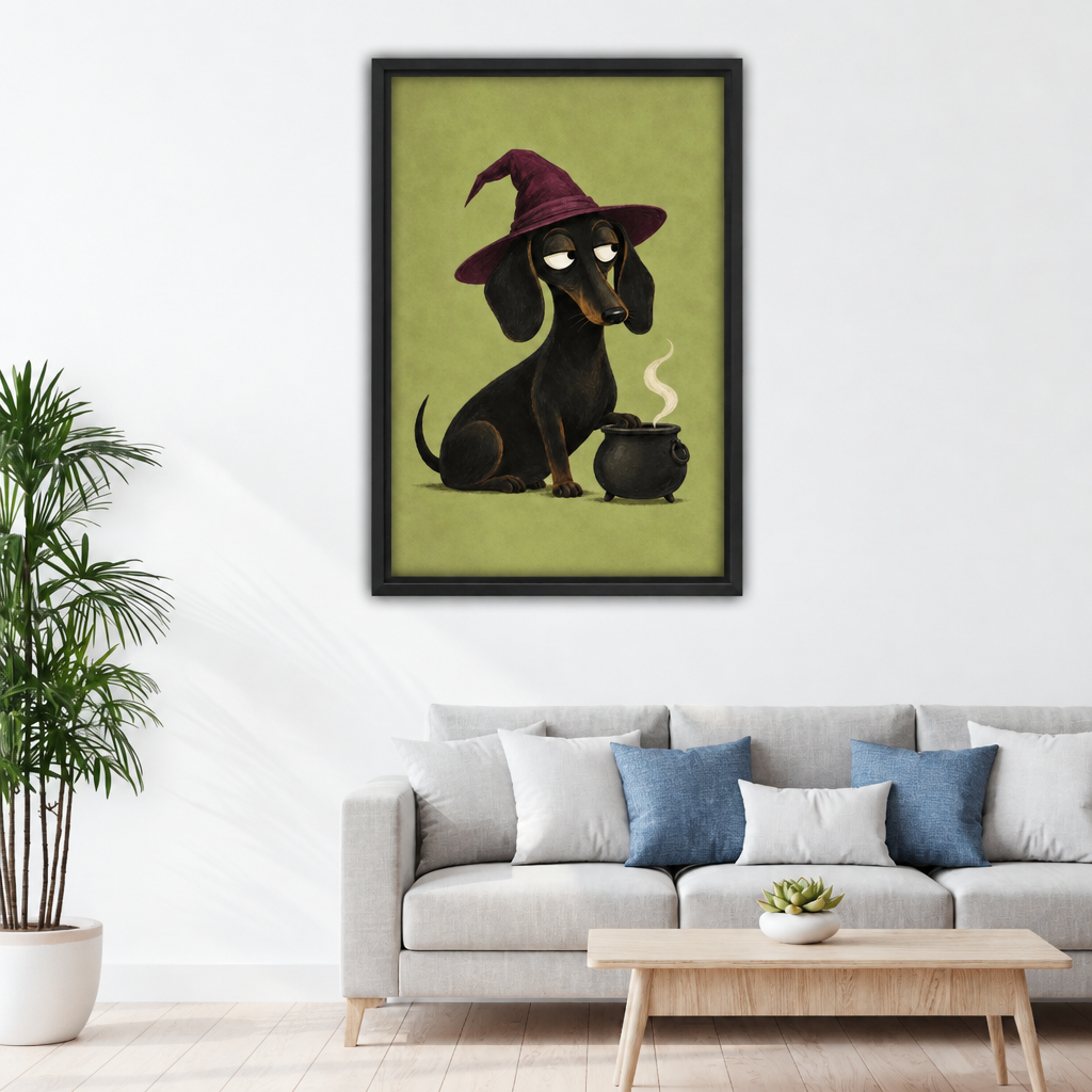 Witch dachshund canvas wall art in a black frame above a light sofa with blue pillows.