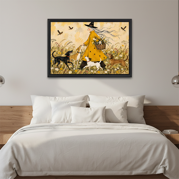 Framed witch and dogs canvas wall art with a yellow dress and flower-filled meadow above a cream sofa.
