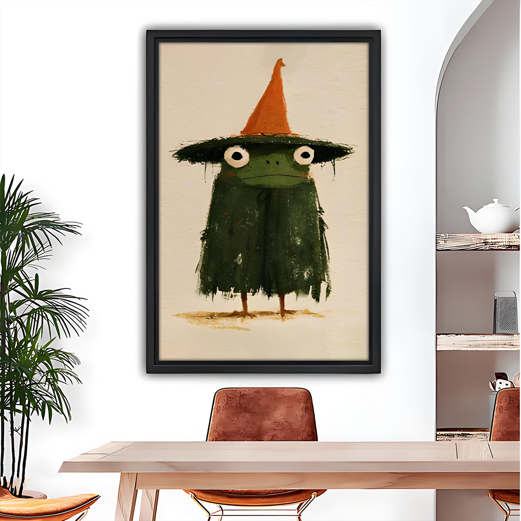 Black-framed witch frog canvas wall art with an orange hat beside wooden bunk beds and colorful toys.