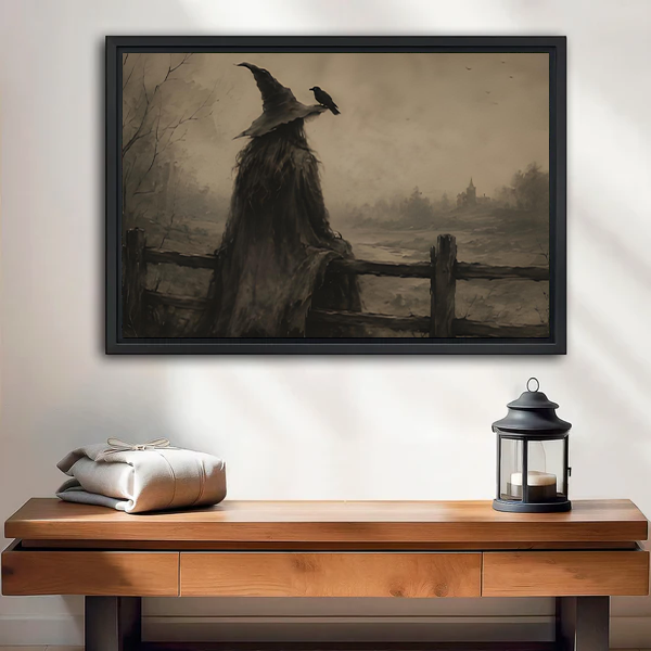 Gallery-wrap witch and raven canvas wall art depicting a misty sepia landscape above a wooden console with a lantern.
