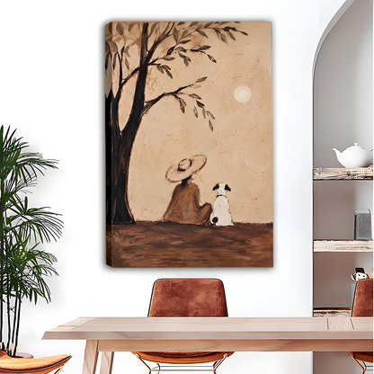 Black framed woman and dog canvas wall art on a white dining room wall above a wooden table and tan chairs
