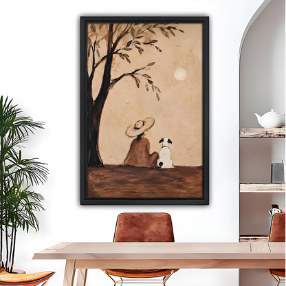 Framed rustic woman and dog under tree canvas wall art hanging above a grey sofa with blue cushions