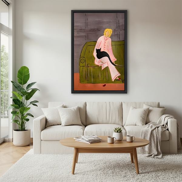 Framed woman with black cat canvas wall art beside a rattan bed with terracotta bedding in a green bedroom.