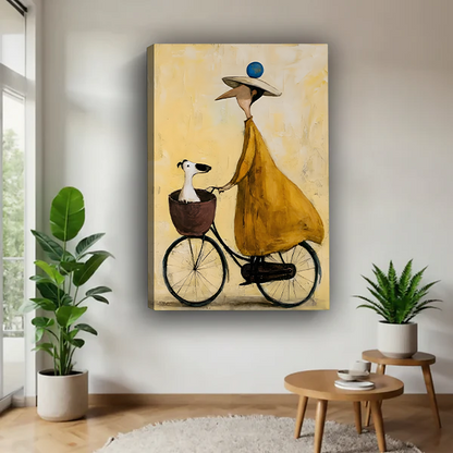 Framed whimsical woman and dog bicycle canvas wall art with a cream background hanging above a cream sofa.