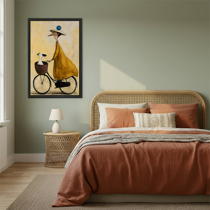 Woman holding framed woman and dog bicycle canvas wall art featuring a yellow dress and oversized hat.