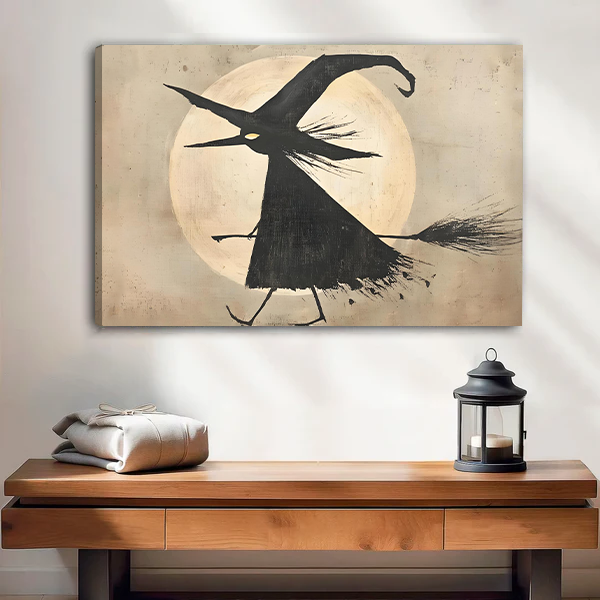 Woman holding framed flying witch moon canvas wall art with a pale full moon in a bright room
