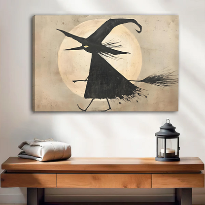 Woman holding framed flying witch moon canvas wall art with a pale full moon in a bright room