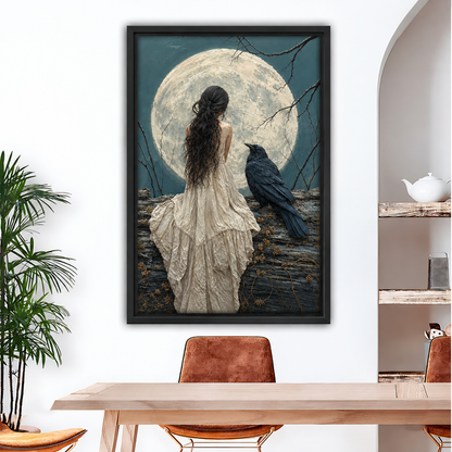 Framed woman and raven moon canvas wall art above a dining table, featuring an ivory dress and pale moon
