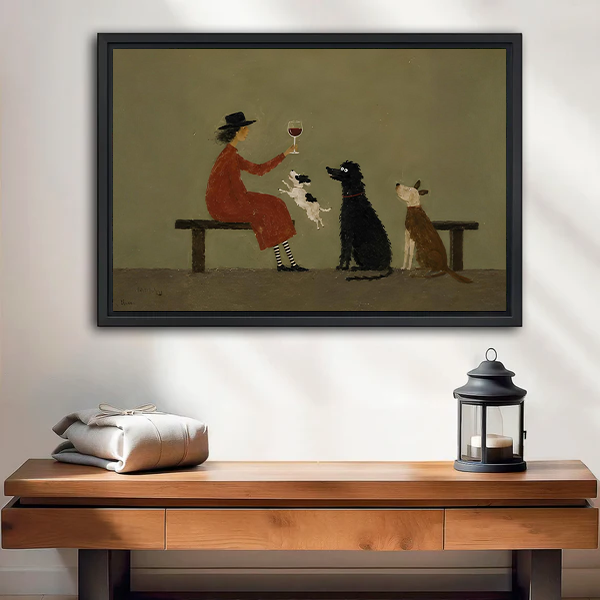 Framed vintage woman toasting three dogs canvas wall art above a cream sofa with linen cushions