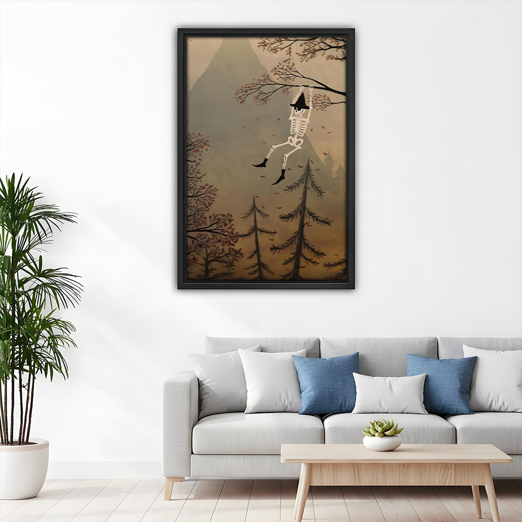 Black-framed woodland skeleton canvas wall art displayed above a gray sofa with blue and white cushions.