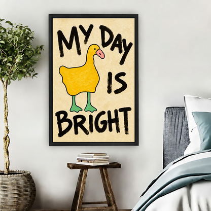 Black framed yellow duck My Day Is Bright canvas wall art above a rustic stool with books beside a bed