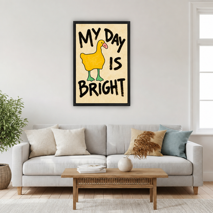Yellow duck My Day Is Bright framed canvas wall art hanging above a light grey sofa and wooden coffee table